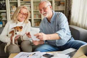 Two seniors research the cost of senior care to find what’s best for them