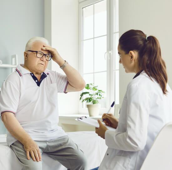 Caregiver caring on an elderly man