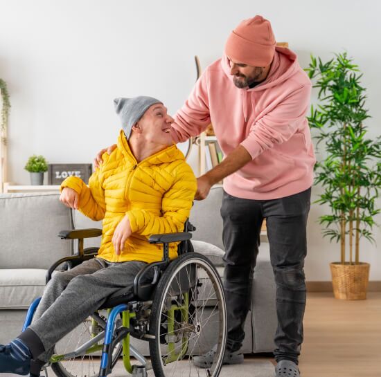 Woman in a wheelchair talking to caregiver