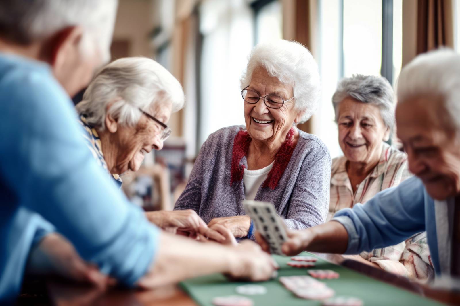 A group of older ladies playing a card game.