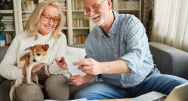 Two seniors research the cost of senior care to find what’s best for them